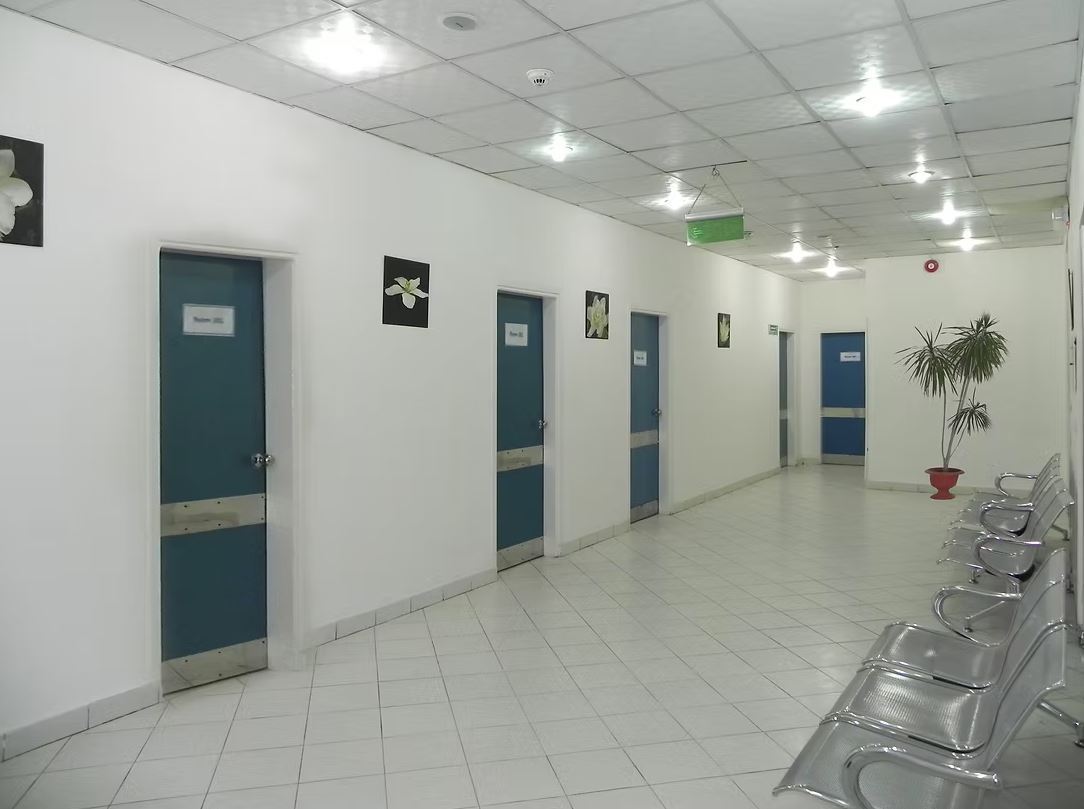 Consultation-room corridor and waiting seats shown in Jasmine Hospital’s official Hurghada gallery